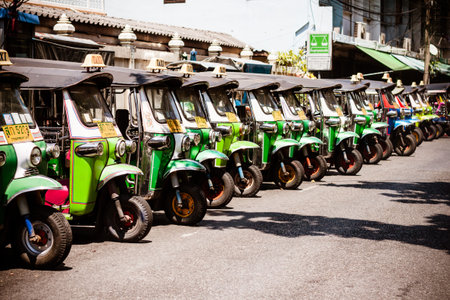 BANGKOK THAILAND  21 APR 2015: Thailand traditional triwheels Taxi  Tuk tuk  lined up in a side ally in Bangkokのeditorial素材
