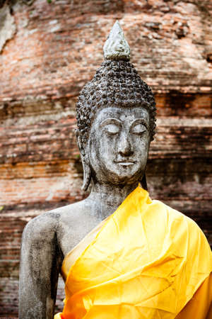 Ancient Buddha statue at Wat Yai Chaimonkol Temple, Ayutthaya, Thailandの写真素材