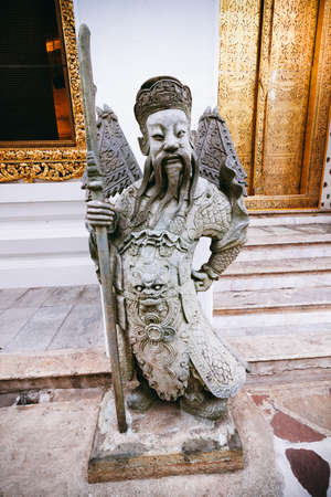 Chinese stone guardian statue in Wat Pho Buddhist Temple Bangkok Thailandの写真素材