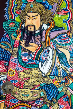Guan Yu deva [God of honor] paint fine art on the door of chinese temple in Thailandのeditorial素材