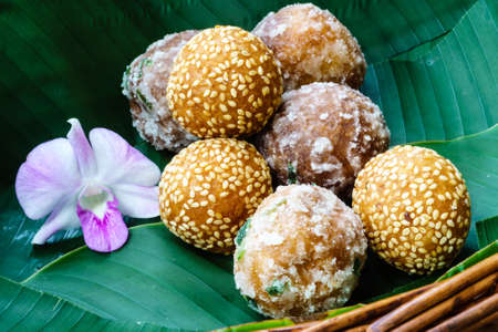 Deep fried dough ball with soybean filling or Kanom Kai Hong (Thai Dessert)の写真素材