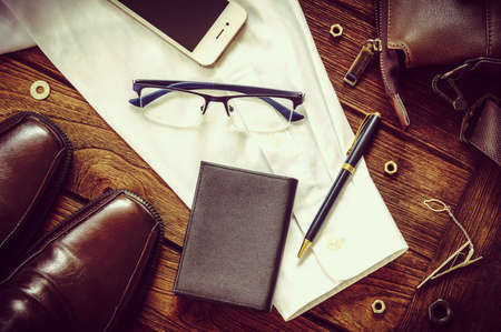 Man accessories on wooden background Top viewの写真素材