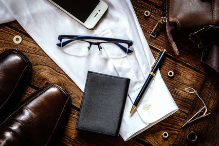 Man accessories on wooden background Top viewの写真素材