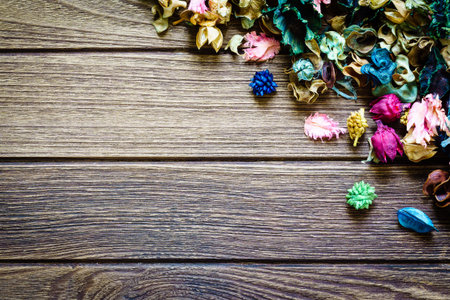 aromatherapy potpourri mix of dried aromatic flowers on wooden background with copy space