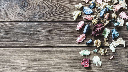 aromatherapy potpourri mix of dried aromatic flowers on wooden background with copy spaceの写真素材