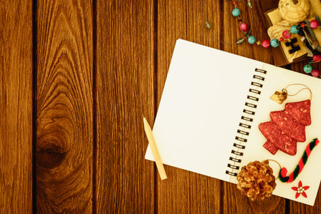 Greeting, Blank paper notebook With Christmas decoration on wooden Background with copy space for...