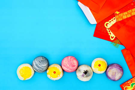 Greeting Happy Chinese New Year background concept - Egg yolk shortcake and Ang Pao red evelope with copy spaceの写真素材
