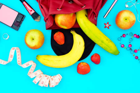 woman diet healthy fruit lifestyle  Concept -  apples , bananas and strawberry with female accessories.Top view, close up.の写真素材