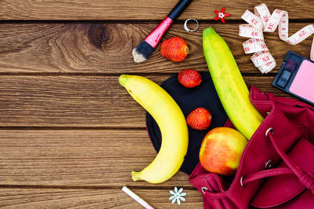 woman diet healthy fruit lifestyle  Concept -  apples , bananas and strawberry with female accessories.Top view, close up.の写真素材