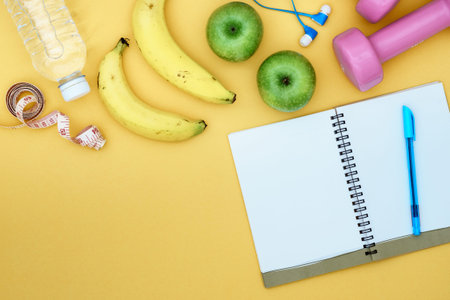 Still Life - Fitness, healthy and active lifestyles Concept, dumbbells, notebook, measuring tape,...