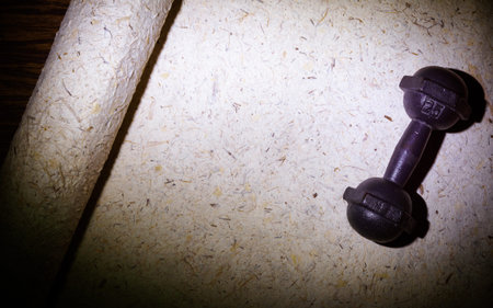 Dumbbell on mulberry paperの写真素材