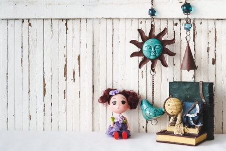 Cute dolls with vintage objects style wooden background with copy space