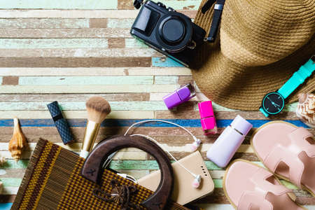 Travel and vacation items on wooden table. Top view with copy spaceの写真素材