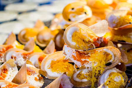 Thai crispy pancake - cream crepes and gold egg yolks, Thailand dessert street foodの写真素材