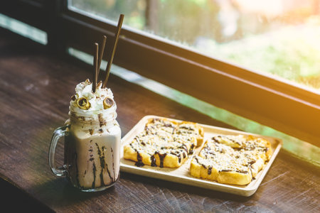 coffee frappe and bread, with creamy tone filter effectの写真素材