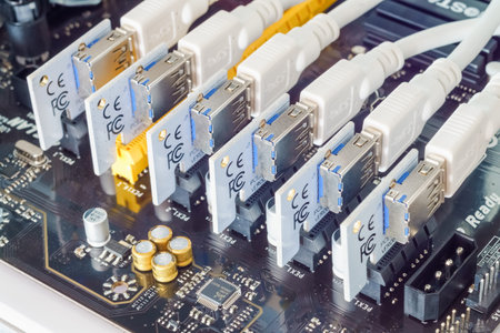 Bangkok, Thailand - August 30, 2017: Close up of PCIE riser card plug to motherboard for mining rig machine to mine for digital cryptocurrency such as bitcoin, ethereum and other altcoins.のeditorial素材