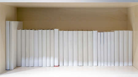 blank books on wooden shelfの写真素材