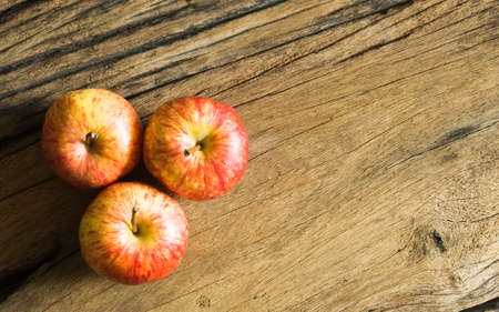 Top view of fresh gala apples on wood background with copy space, Healthy fruit for healthy life conceptの写真素材