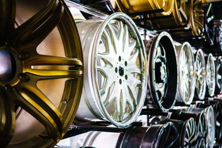 wall of alloy car wheels in storeの写真素材
