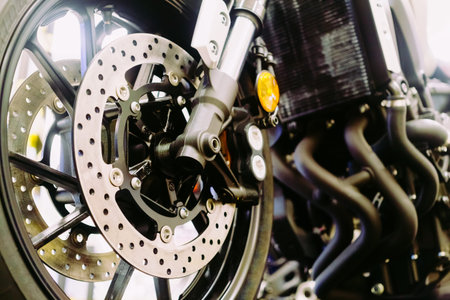 Close up of a motorcycle wheel, Suspension and disc brake system of modern motorcycle's front wheel.の写真素材