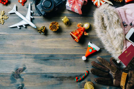 Christmas travel concept. Accessory women to travel Christmas and Happy new year concept background. Top view shot of sign winter season holidays trip.の写真素材