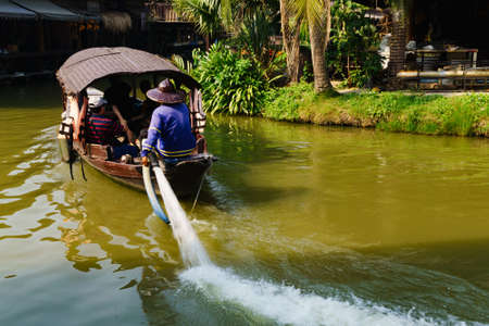 A tourist boat to visit the floating market Ayodhya.Ayutthaya,Thailand.  in Floating market, Thai traditional lifestyle. Ayutthaya traveling background.の写真素材