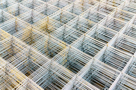 iron mesh or wire mesh texture background for backdrop or wallpaper, wire mesh or iron mesh use for reinforce concrete in construction siteの写真素材