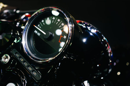 close up shot of motorcycle control panel  with speedometer dashboard or speed meter