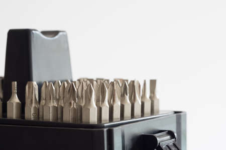 Metal bits for screwdriver. Tool set for household use. Nozzles and adapters for screwdrivers. Head different size hex driver. A set of tools collection from heads for screwdriver on white background with copy space.の写真素材