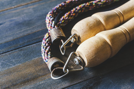 Close up of jump rope on wood background. Still life of old skipping rope close up on wooden plank.の写真素材