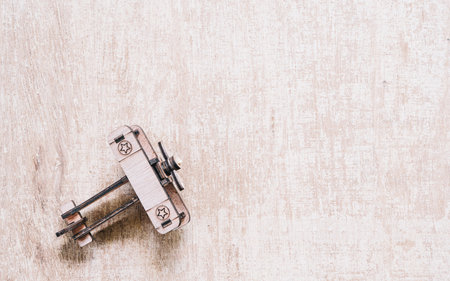 Wooden plane,airplane model on wood background. Top view, Flat Lay with copy space.の写真素材