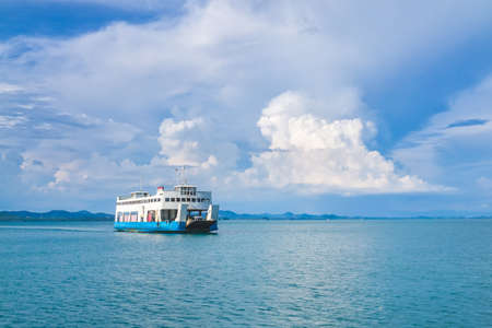 Ferry Boat to Koh Chang Island in Trat, Thailand with big blue sky and cloud for Koh Chang, Thailand Holiday background.の写真素材