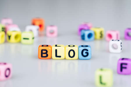BLOG word text written on colorful cube with bokeh cube word block backgroundの写真素材