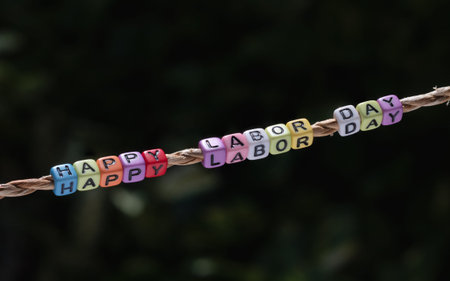 Labor day background concpet. Happy Labor Day word hanging by a ropeの写真素材