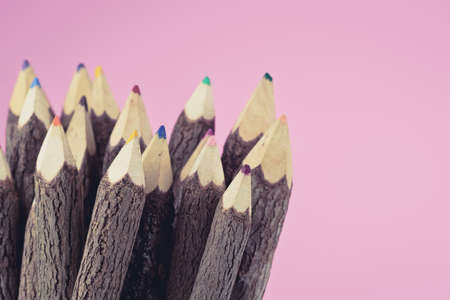 Stack of colored pencils on pink background. selective focus. Ready to back to school background concept.の写真素材