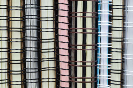 Stack of ring binder notebooks background texture. Ideal for Back to school and office work concept.の写真素材