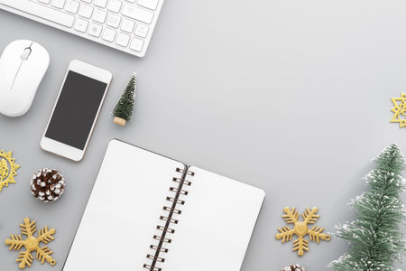 Christmas Office desk table flat lay with computer wireless keyboard, mouse, smart phone, blank...
