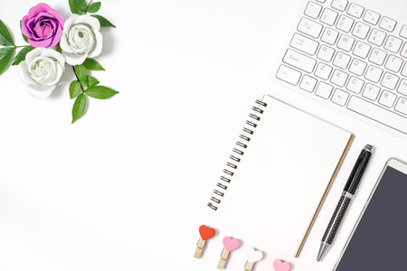 Valentines Office desk flat lay concept. Office feminine desk, workspace with wireless keyboard,...