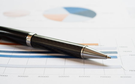 Close-up pen on financial report. Concept of Infomation Data Analysis, Business Investment Analytics and Business Planning. Web Banner.の写真素材