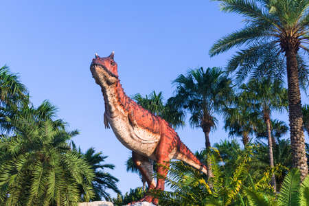 Pattaya,Thailand- April 14,2018: Carnotaurus model in a tropical garden park of Suan Nongnooch, Pattaya, Thailand. Carnotaurus is a genus of large theropod dinosaur.のeditorial素材