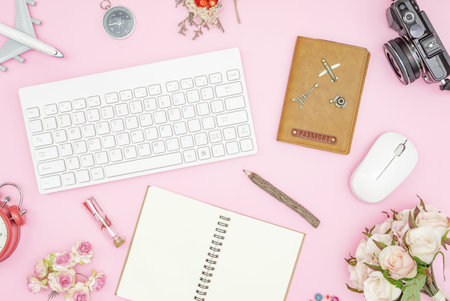 Flat lay pastel design of Valentines' day travel concept. Top view of blank notebook, wireless...