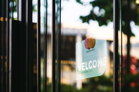 Bangkok, Thailand - March 03, 2019: Mastercard accepted and welcome sign hangs in front of a shopping store in in Bangkok, Thailand.のeditorial素材