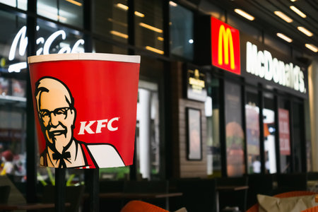 BANGKOK, THAILAND- March 16, 2019: The logo of KFC nearby the McDonald store in Bangkok, THAILAND