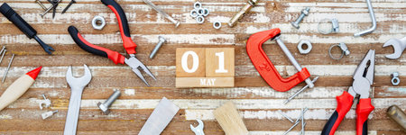 1st May. Happy International Worker's day or Labour Day Web banner background concpet.  wooden block...