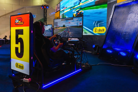 Bangkok, Thailand - March 31, 2019 : Gamers driving simulation car with reality screen E Sport...
