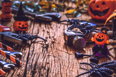 Happy Halloween day with construction DIY handy tools on rusty wooden background concept with copy...