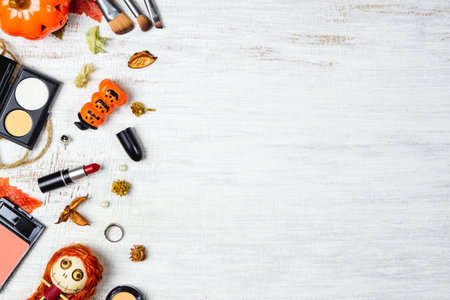Flat lay Female cosmetics in Autumn and Halloween festival background concept. Top view with copy...