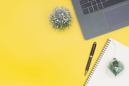 Merry Christmas and Happy new years office work space desktop concept. Flat lay top view with laptop...