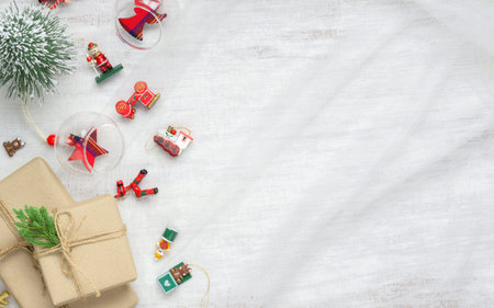 Merry Christmas and Happy New Year background with xmas decorations and gift boxes on nest fabric on...