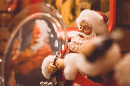 Merry Christmas and Happy new year background. Close up image of Santa Claus Doll on Christmas time vintage retro tone.の写真素材